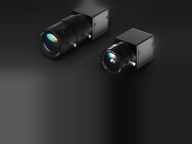 Pair of swing cameras for a golf simulator